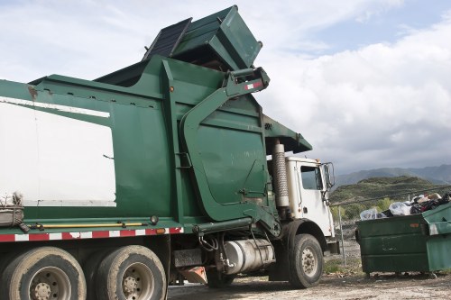 Team handling construction debris for business waste removal