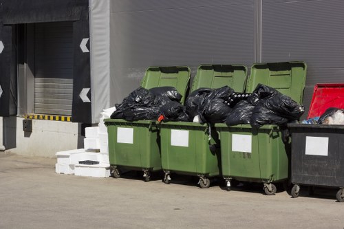 Workers managing and sorting construction debris